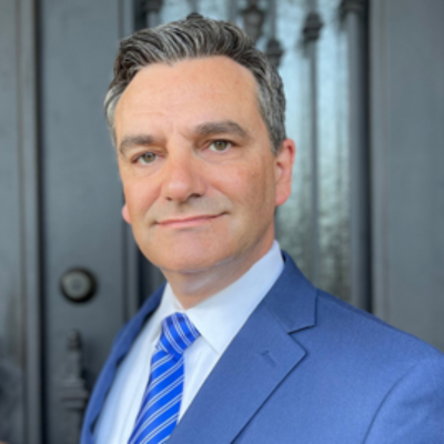 A portrait of a man in a suit